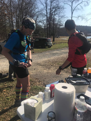 Woman in Ponya Bands Bamboo Jersey Lined Sweatband at race aid station