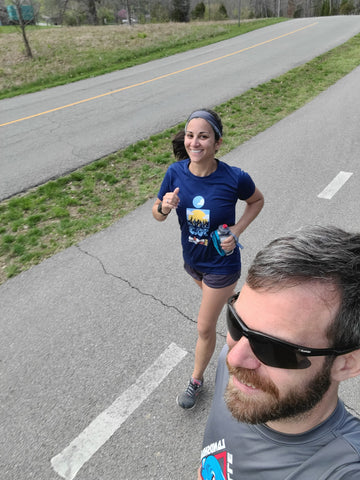 Woman running wearing Ponya Band bamboo sweatband