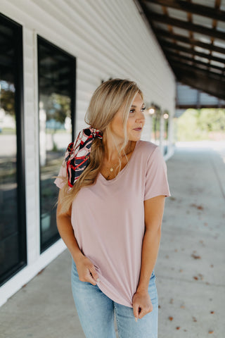 The Charlie Tee in Blush, styled with a hair scarf. 