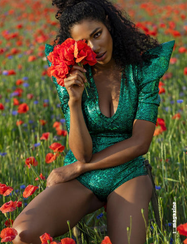 Shari Streich wearing green bodysuit in poppy field