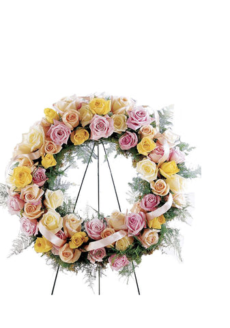 funeral flowers pastel rose open heart wreath