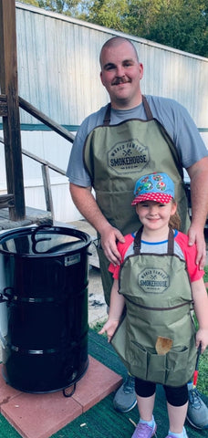 justin and daughter with pit barrel cooker
