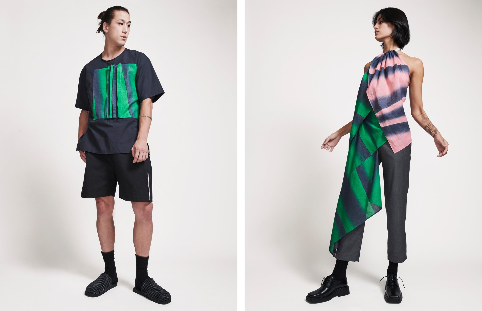 Male model in navy and green t-shirt and shorts on the left, green and pink draped look on female model on the right