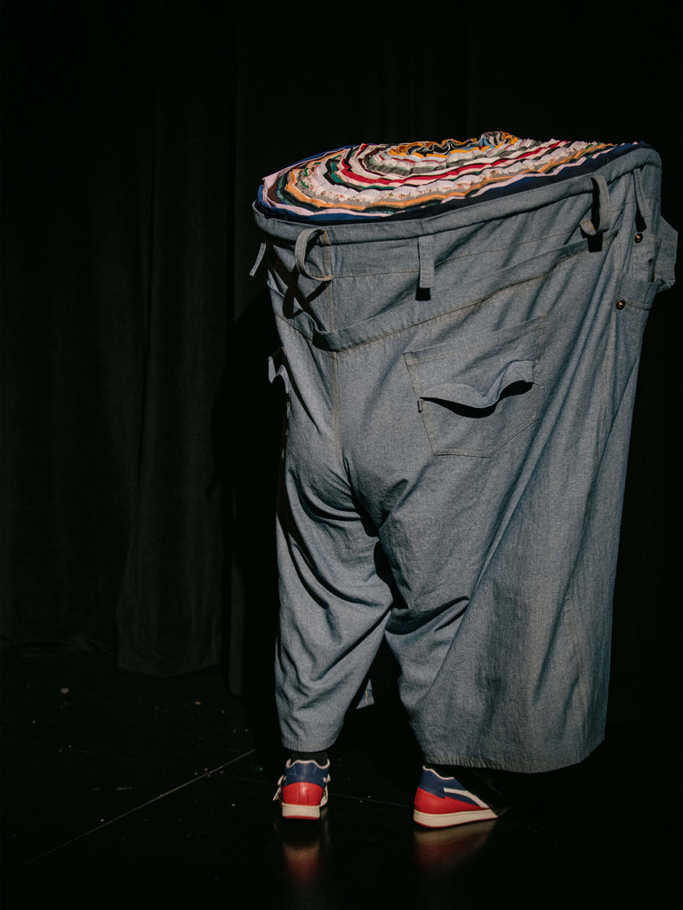 Giant denim pant puppet explores the stage