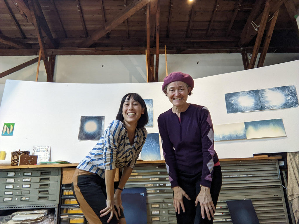 Sarah and Jenny smile for the camera in Sarah's studio