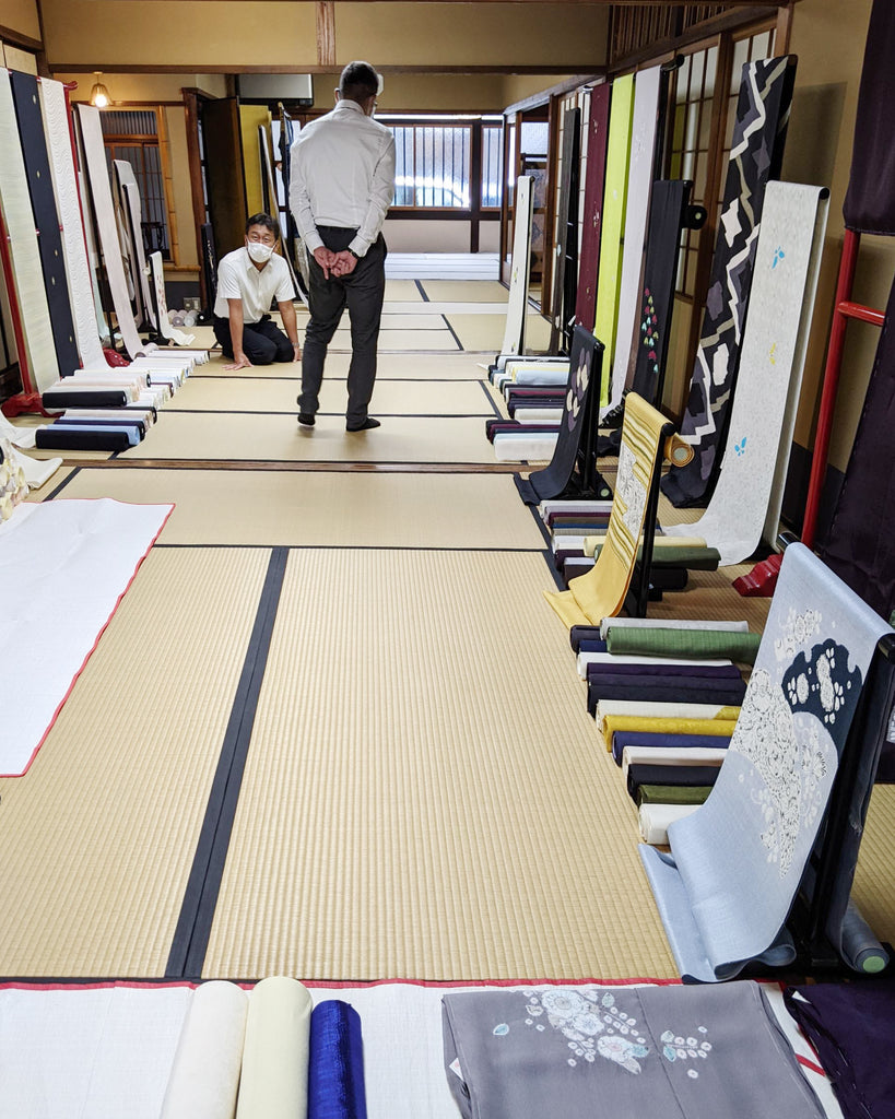 Tatami mat showroom with kimono fabrics on display