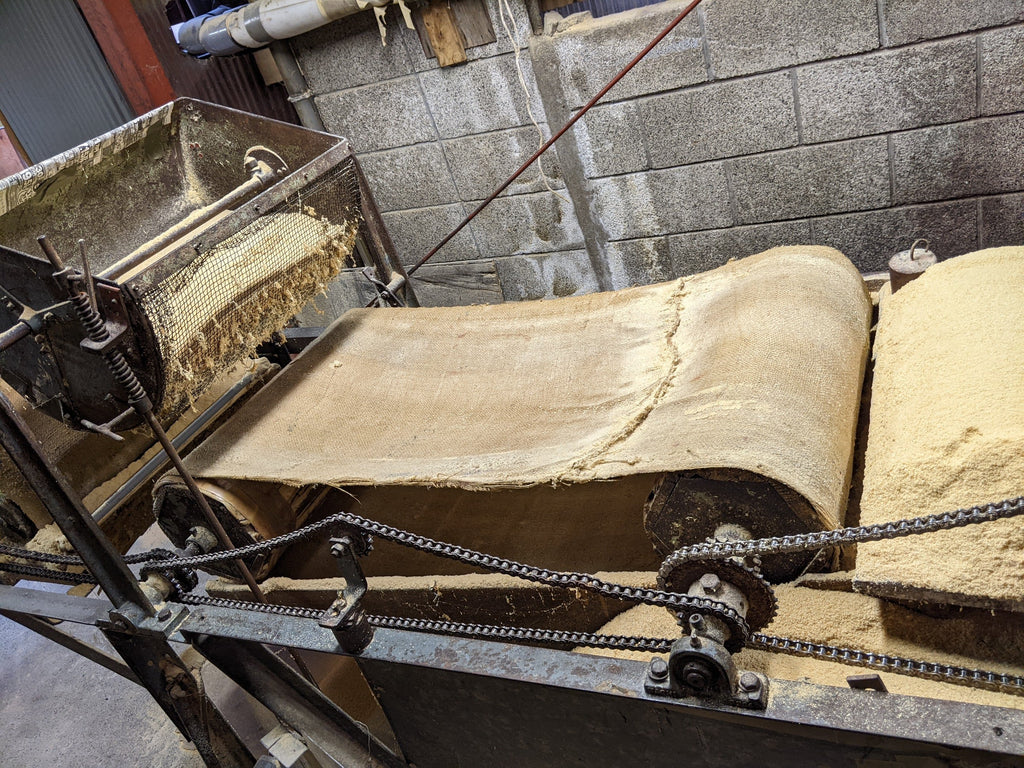 Close up of sawdust on the roller machine