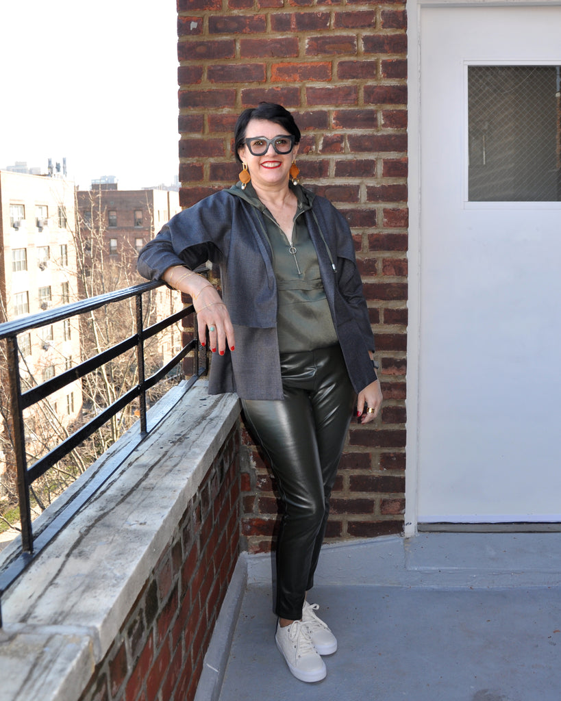 Silvia d'Avila smiles on rooftop.