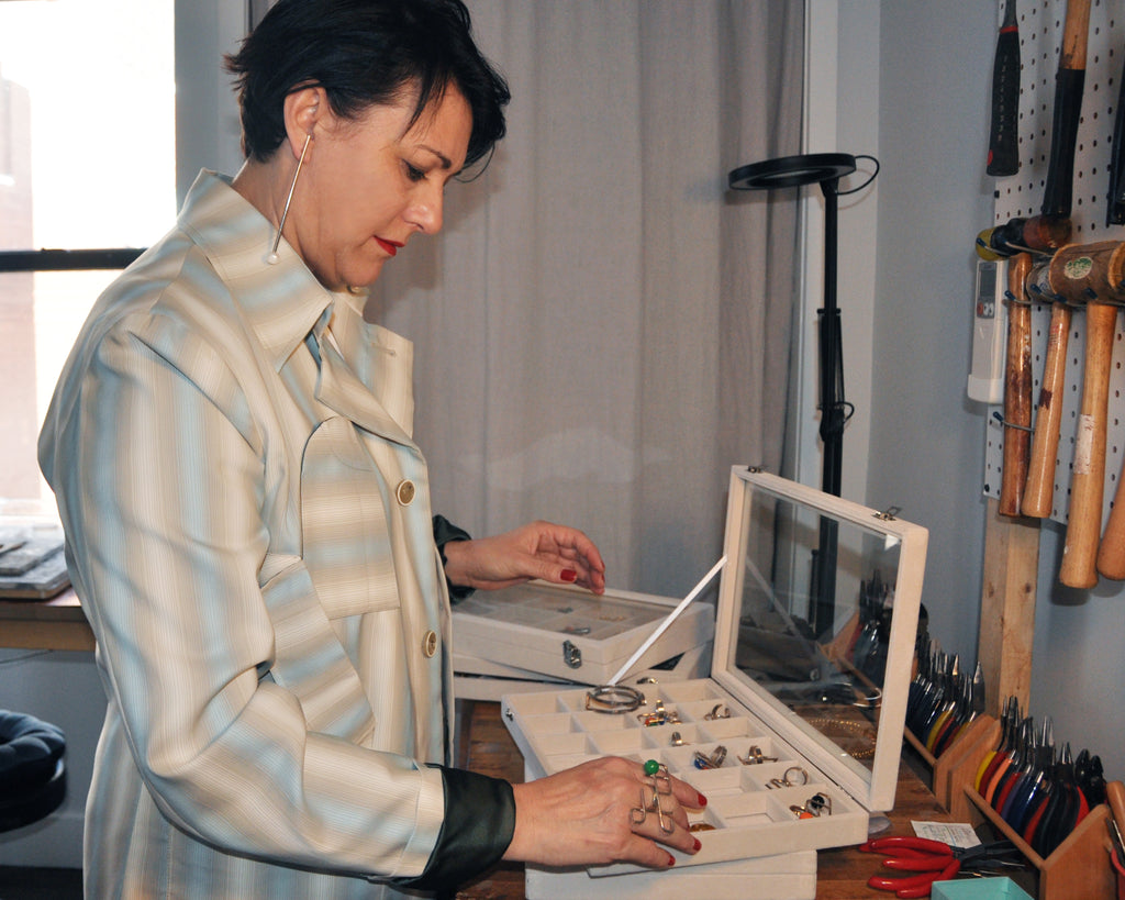 Silvia D'avila looking through her jewelry
