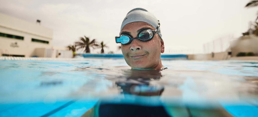 swimmer in pool wearing FORM swim goggles