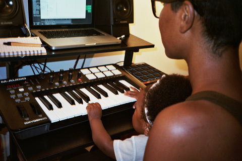 baby learning piano