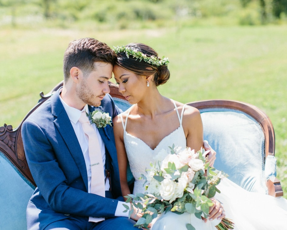 bride in wtoo bridal gown with her groom 