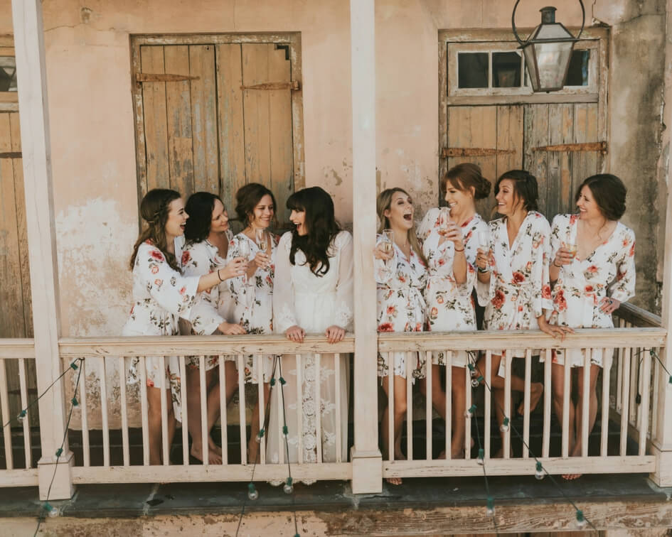 getting ready with the bridesmaids in floral robes 