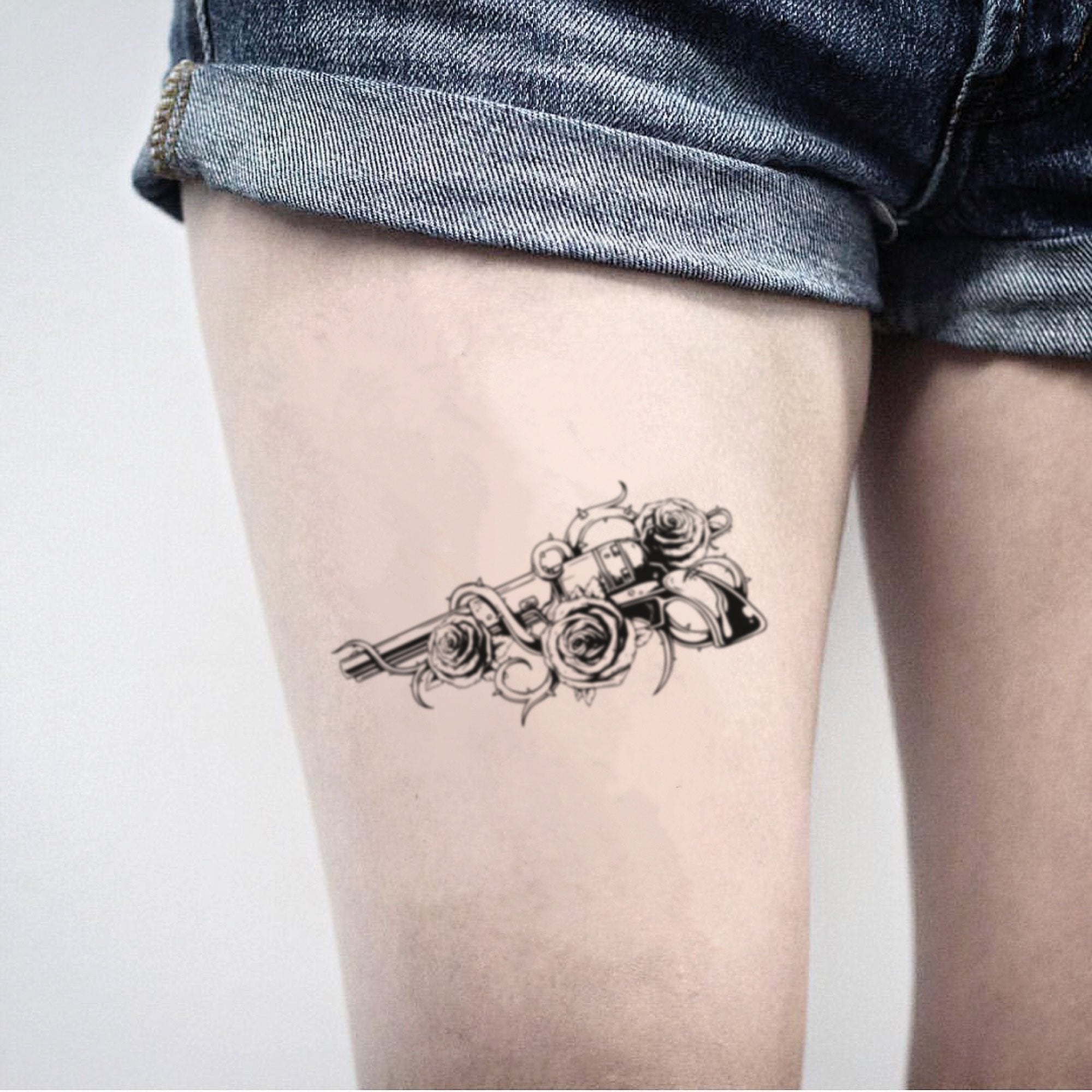guns and roses thigh tattoo