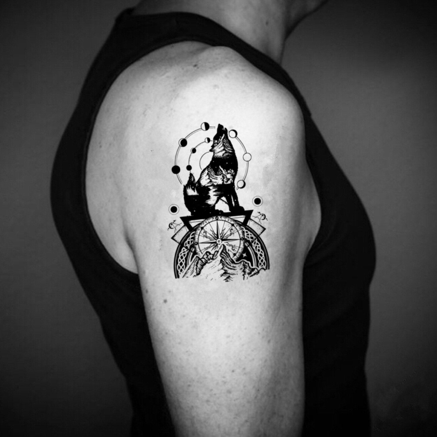 wolf howling at moon tattoo