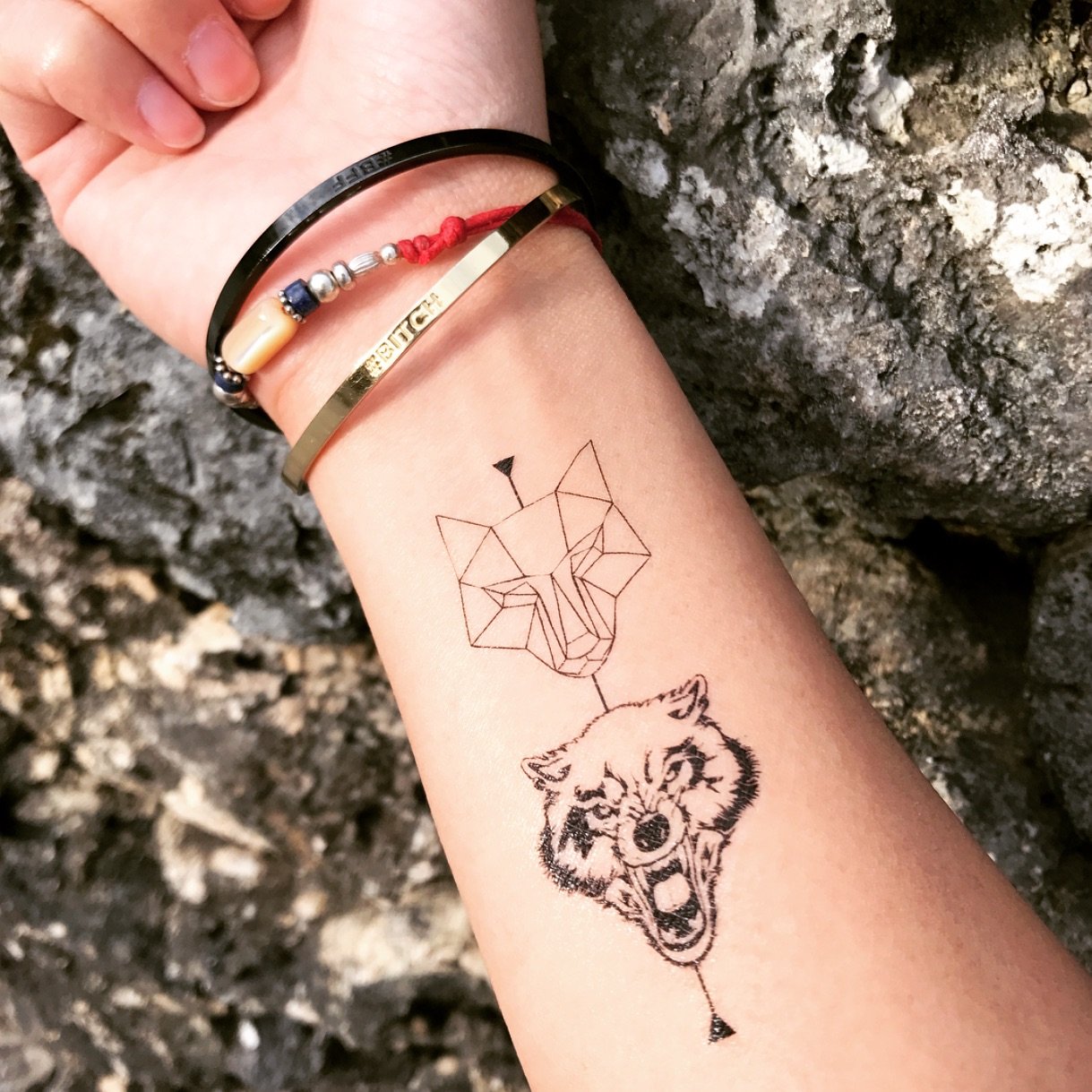 small wolf tattoo wrist