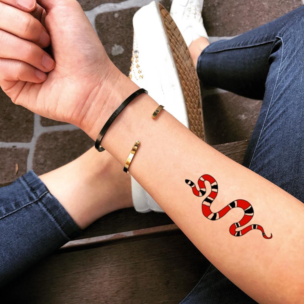 gucci symbol tattoo