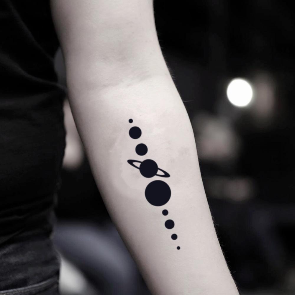 Minimalistic style Solar System tattoo located on the