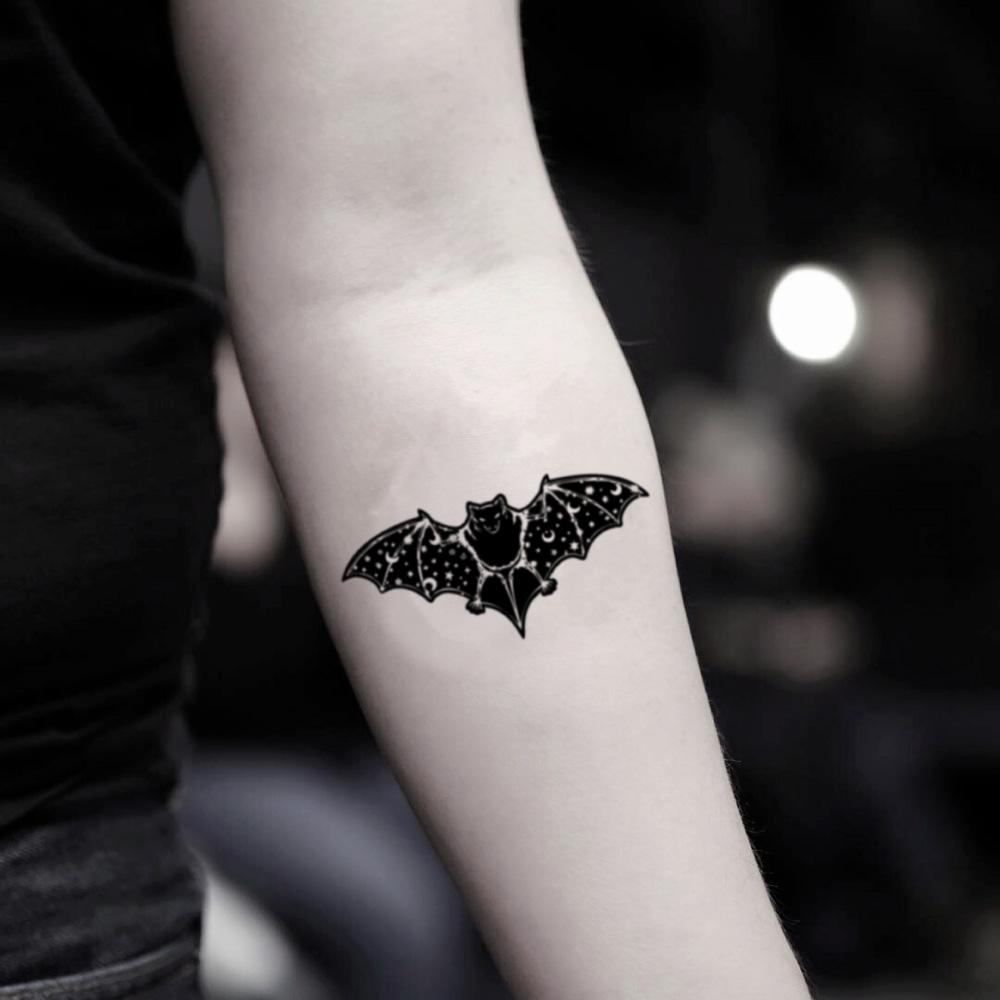 Bat tattoo located on the inner forearm