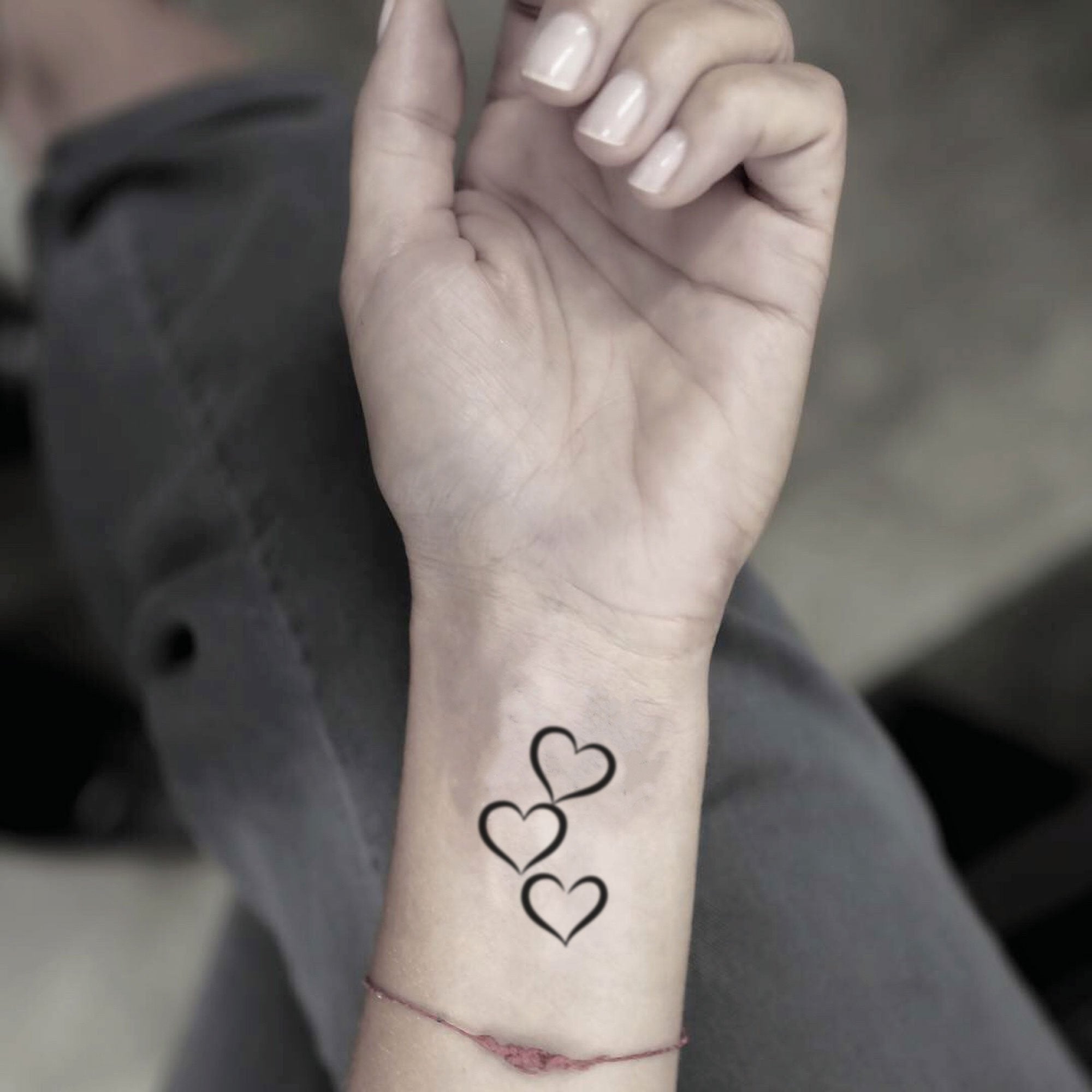 3 hearts intertwined tattoo