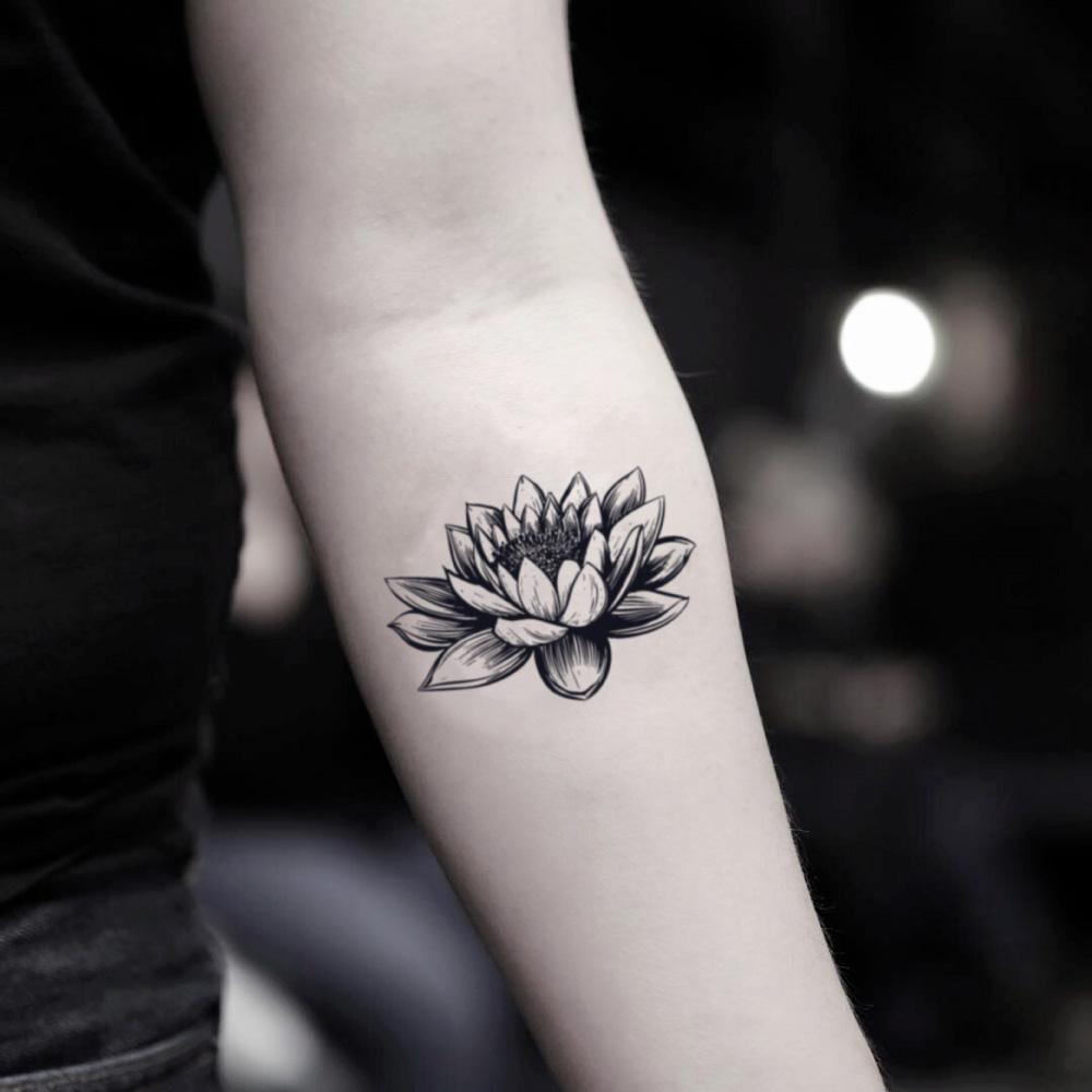 X-Ray lily flower tattoo located on the shoulder blade.