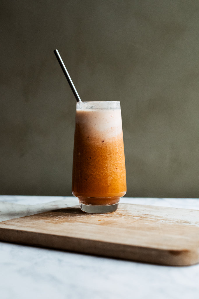 Ginger, Carrot, Apple Super Smoothie - image of glass of smoothie with straw