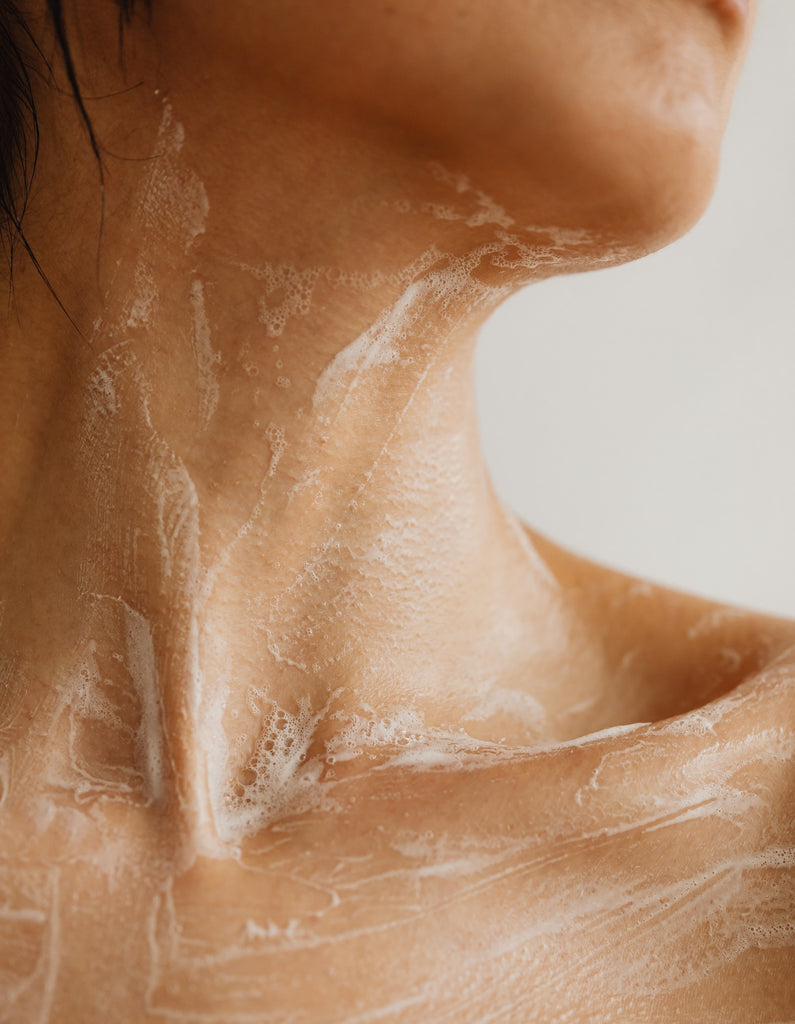 soapy decolette close up indicating skin under a shower
