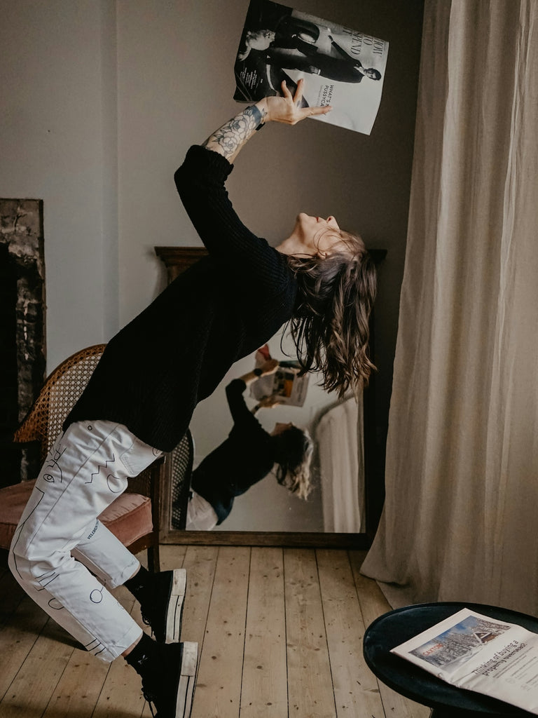 woman dancing or celebrating relating to positive steps to manage stress and build resilience