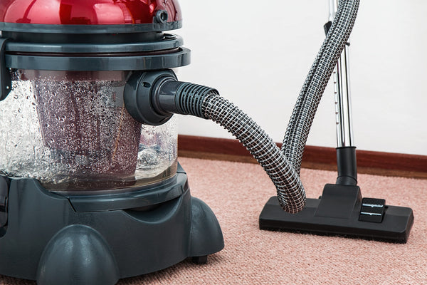 Wet and Dry Vacuum cleaner on red carpet