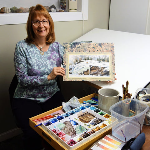 Karen Richardson painting in her studio