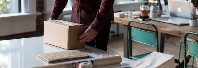 Man wrapping parcel