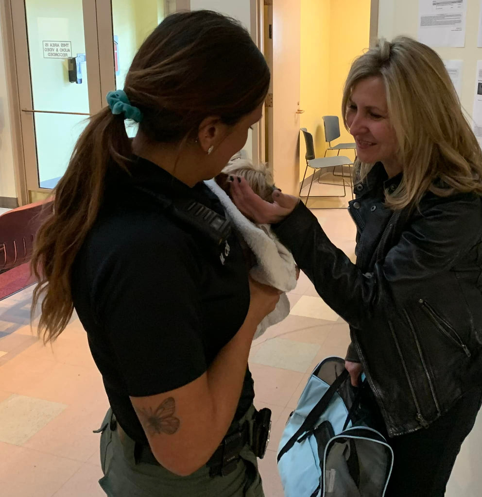 Rex and his owner thank the animal control officer