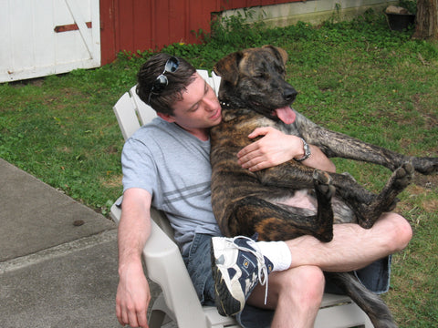 Hank and Eric sit on a chair