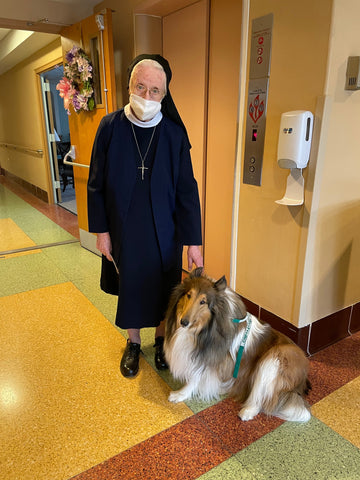 Ingrid with a nun while working as a therapy dog