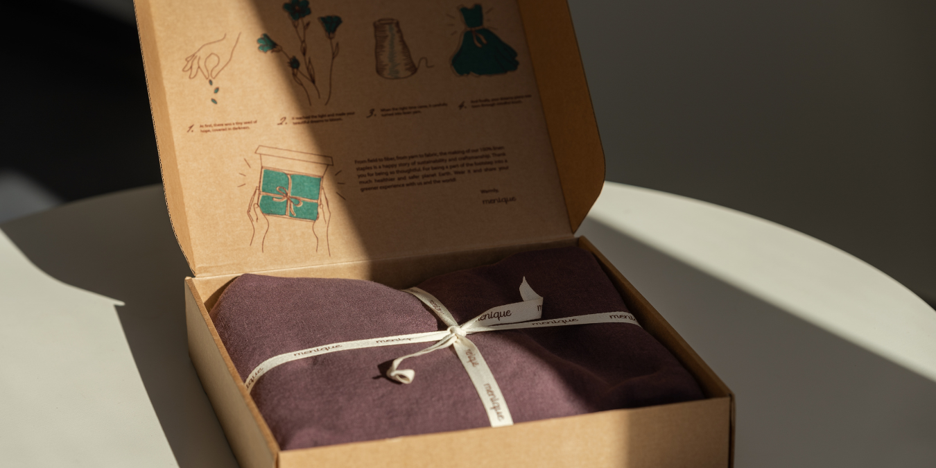 menique Linen clothing packed in a plastic-free cardboard shipping box