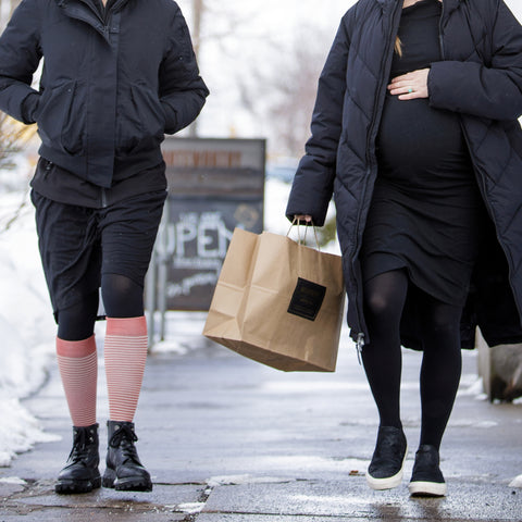 women wearing compression legwear while shopping