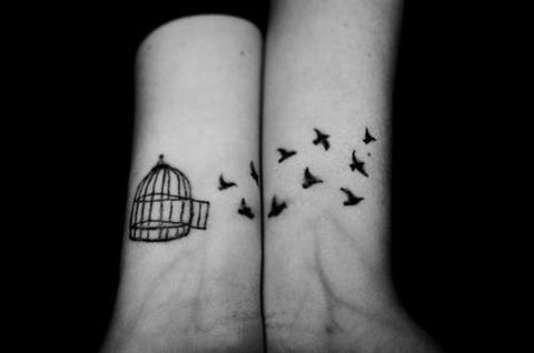 Couple tattoos birds and cage