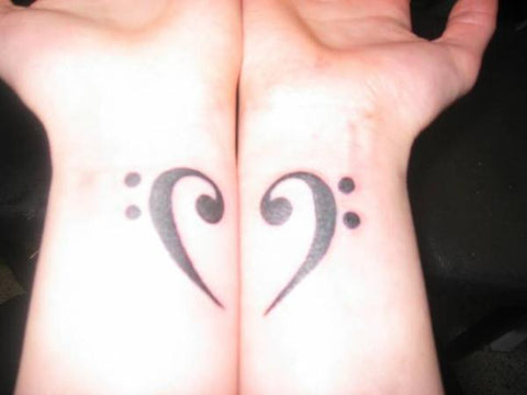 Matching couple tattoo black heart