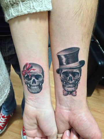 Couple tattoos skulls