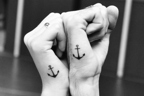 Couple tattoos anchors