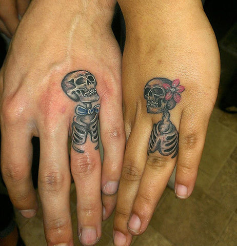 Couple tattoos skeletons