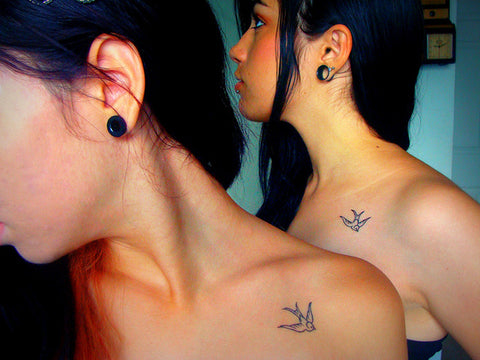 Couple tattoos Swallows