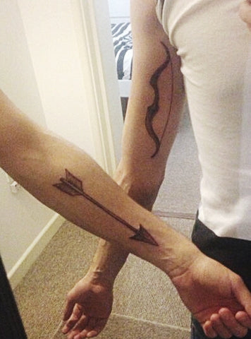 Couple tattoos bow & arrow