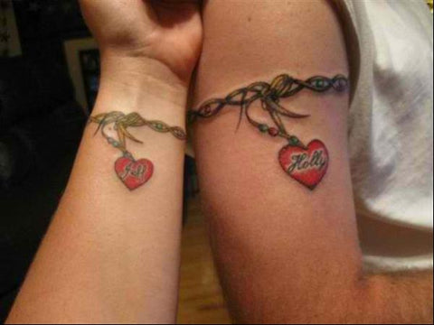 Matching couple tattoo names heart