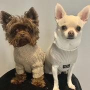 Two dogs wearing Over Glam jumpers