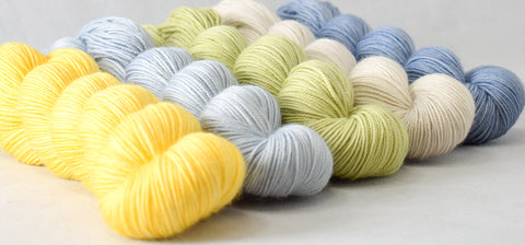 Yummy 3-Ply yarn in shades of yellows, greens, and blues