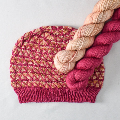 Pink and rose gold hat with yarn