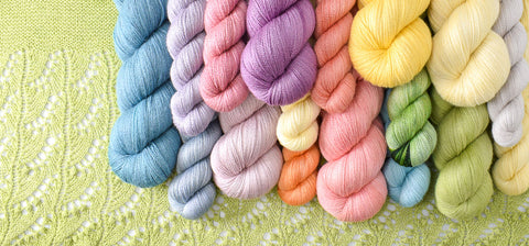 Yearning yarn in spring colors on knitted lace