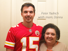 Peter Yadrich in red Patrick Mahomes Kansas City Chief's Jersey number 15 with his mom Donna Yadrich