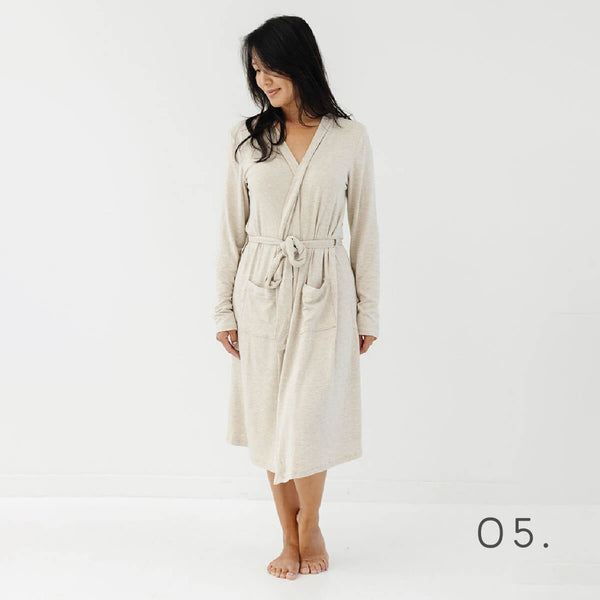 Woman standing looking to her right wearing the Flax Plain Jane Robe